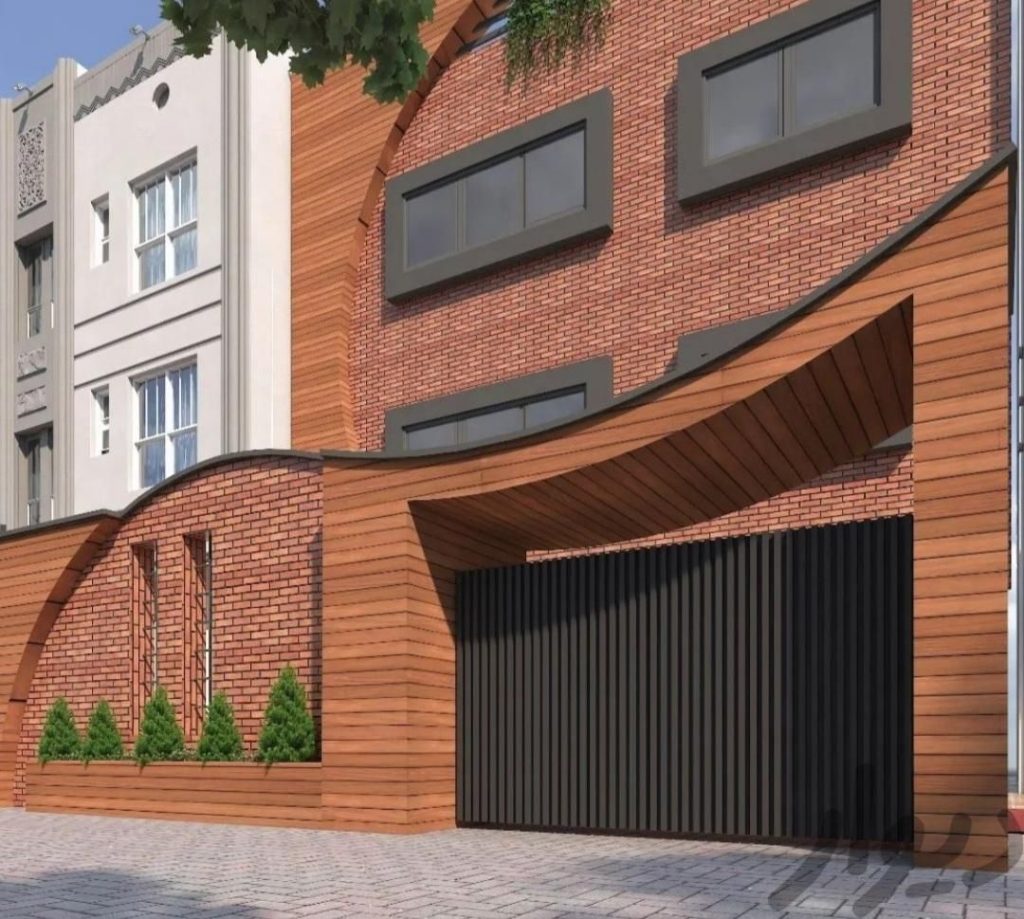 نمای آجری ساختمان مدرن با خطوط منحنی، ترکیب آجر نسوز و ترمووود، دیوار حائل آجری با فضای سبز مینیاتوری